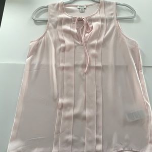 Women’s, light pink, sleeveless J.Crew size xs. Front tie up.